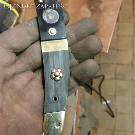 Navaja handle with the bronze flower pin